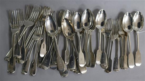 A matched part service of silver fiddle pattern flatware, crested, 64oz gross